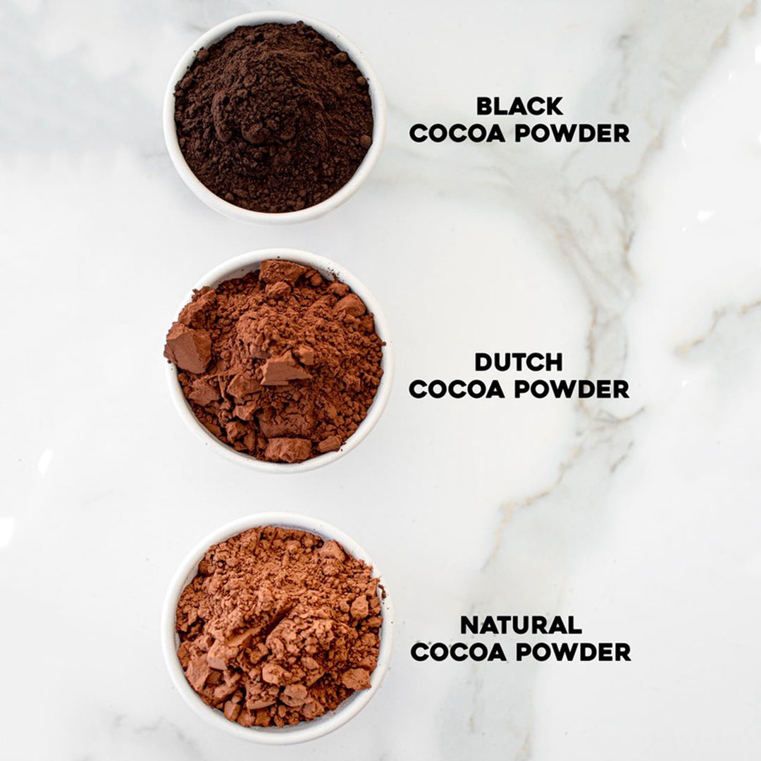Black Cocoa Powder, Dutch Cocoa Powder, and Natural Cocoa Powder from darkest to lightest in small bowls