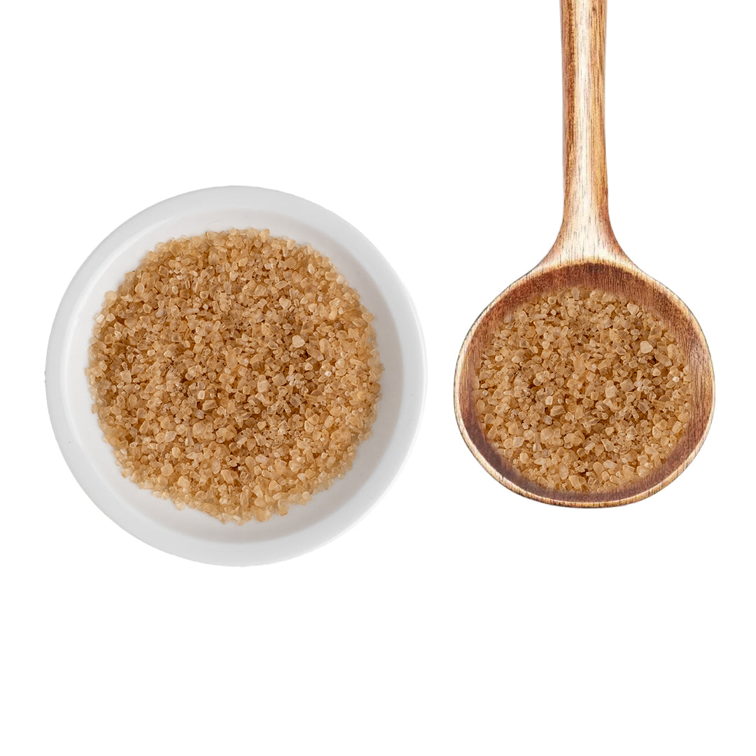 Bourbon Smoked Sea Salt in white bowl next to wooden spoon