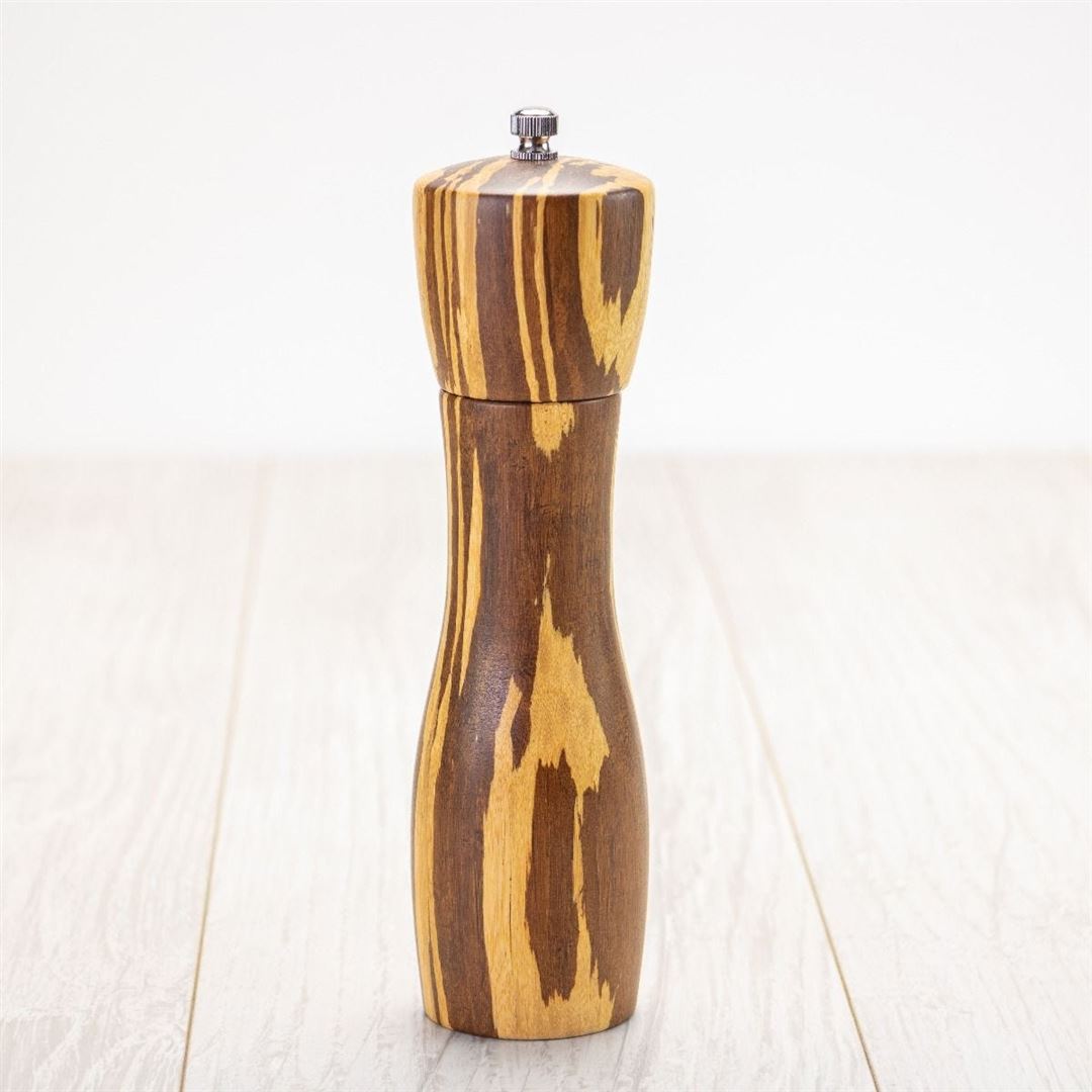 The 8" Crushed Bamboo Pepper Mill, featuring a natural striped wood grain, stands upright on a light wooden surface against a plain white background—an ideal unique kitchen gift.