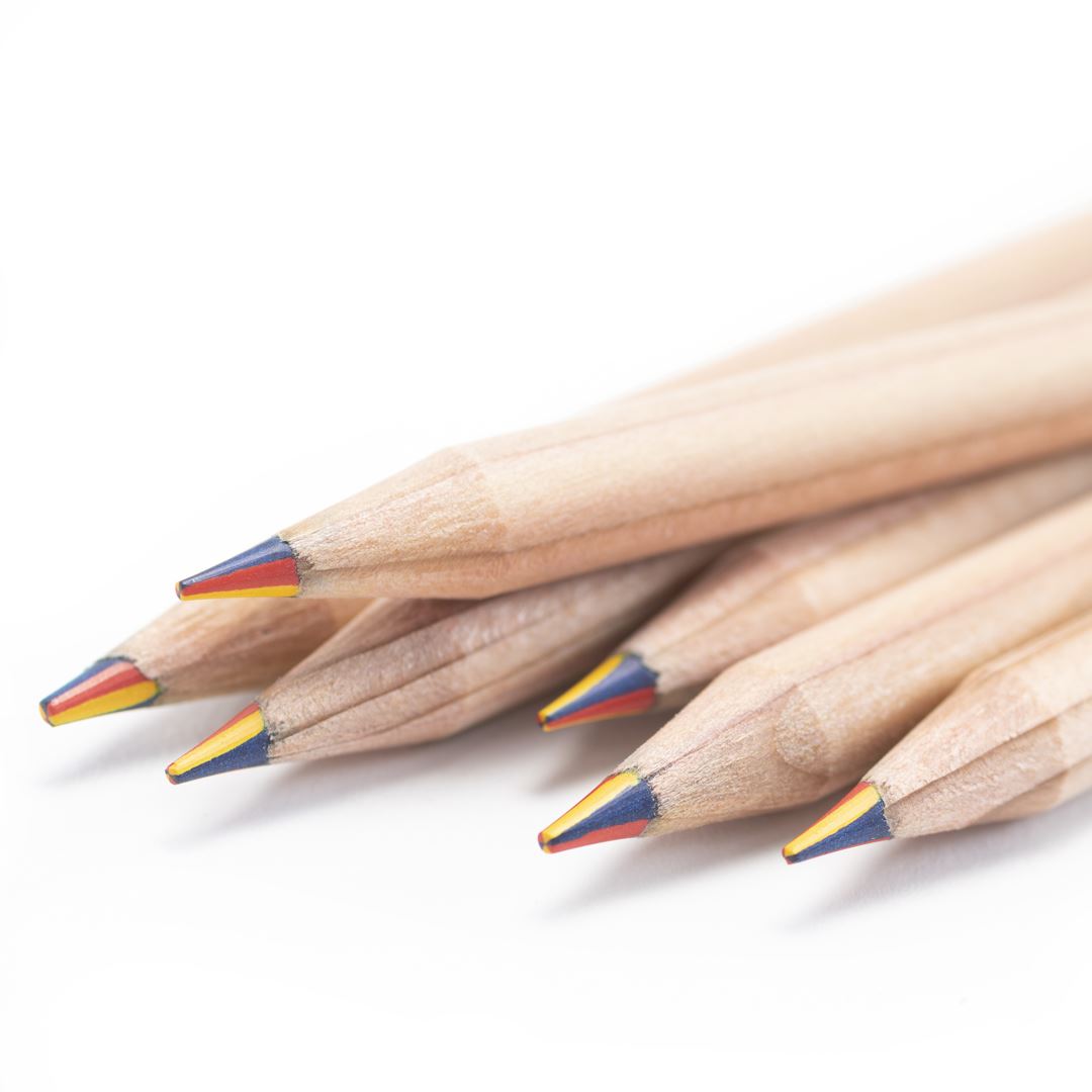 A close-up of six Herb Pencils with red, yellow, and blue tips arranged in a fan on a white background. Each plantable, sustainable pencil includes a seed capsule for eco-friendly growth after use.