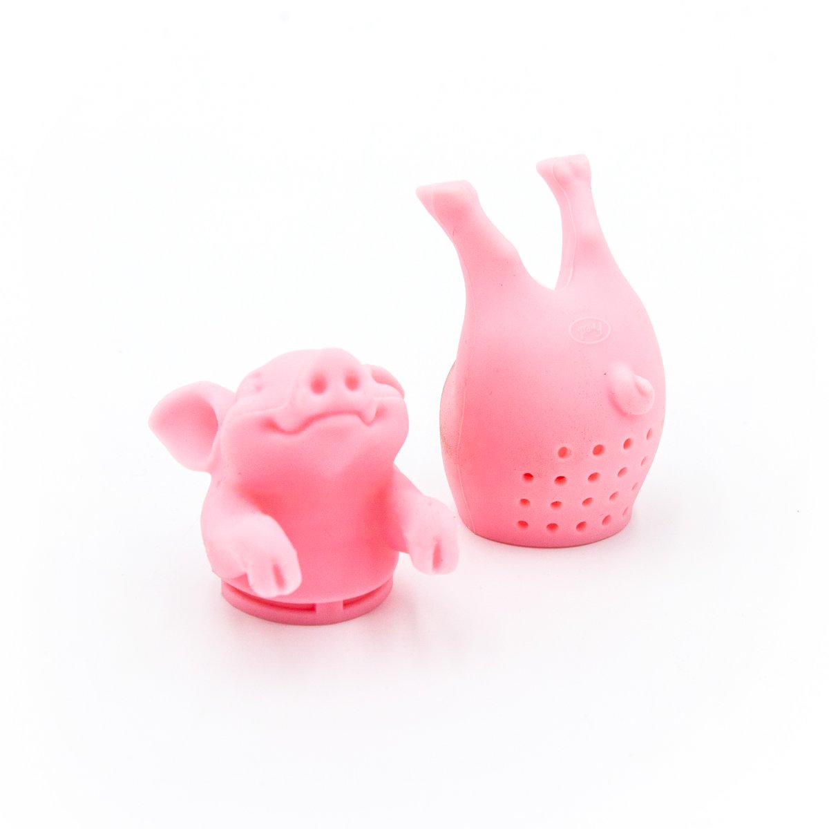 Two Hot Belly Infuser tea strainers—pink, BPA-free silicone pig shapes (one with head/front legs, one with hind legs)—stand on a white background. Each has holes for steeping your favorite loose leaf tea.