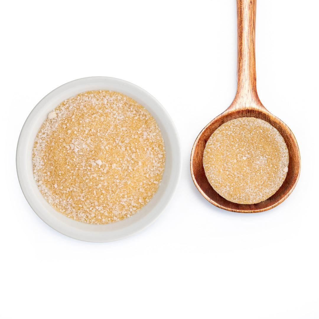 Kettle Korn Sugar in white bowl and on wooden spoon