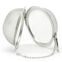 The Mesh Ball Infuser, made of stainless steel with a fine mesh and metal rim, opens to reveal both halves. It includes a chain with hook for securing to your cup or teapot—ideal for rich loose leaf tea flavor every time.