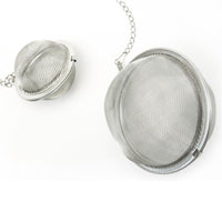 Two Mesh Ball Infusers with chains rest on a white background. The larger, pot-sized Mesh Ball Infuser is in front, while the smaller one is positioned further back.