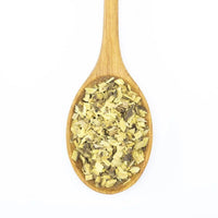 A wooden spoon holds Licorice Root - Cut & Sifted, featuring dried, chopped yellow and light brown herbs known for digestive support, displayed on a white background.