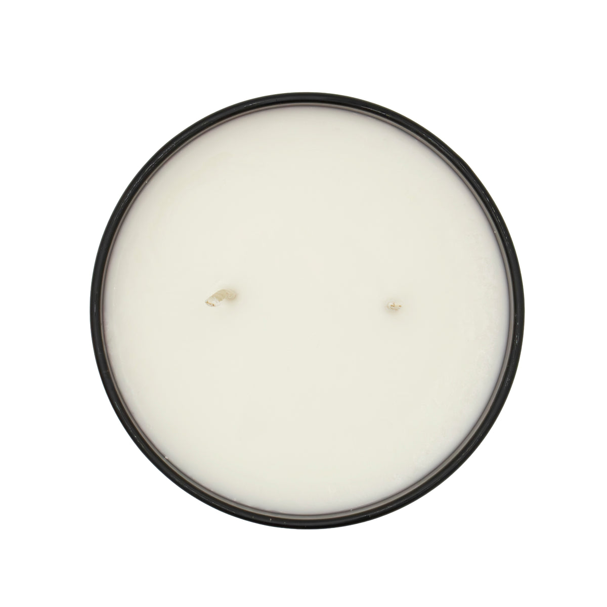 Round candle with a black lid on a white background