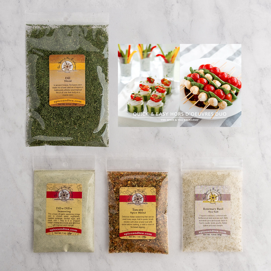 The Quick & Easy Hors d'Oeuvres Duo (Kit) features five seasoning packets—Dill Weed, Dillie Dillie, Tuscany Soup Blend, and Rosemary Basil—arranged on a marble surface with a canapés recipe card displayed above.