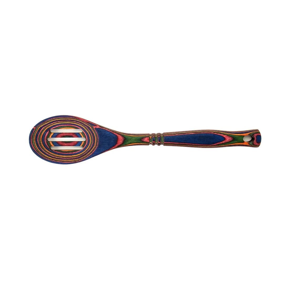 The Rainbow Slotted Spoon features a durable pakkawood design with layered, multicolored rings—blue, green, red, yellow, and orange—on the head and handle. Displayed against a white background.