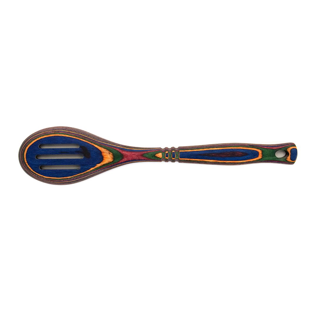 The Rainbow Slotted Spoon features a durable, eye-catching pakkawood handle and head with blue, green, red, yellow, and orange patterns. This practical utensil is shown on a white background.