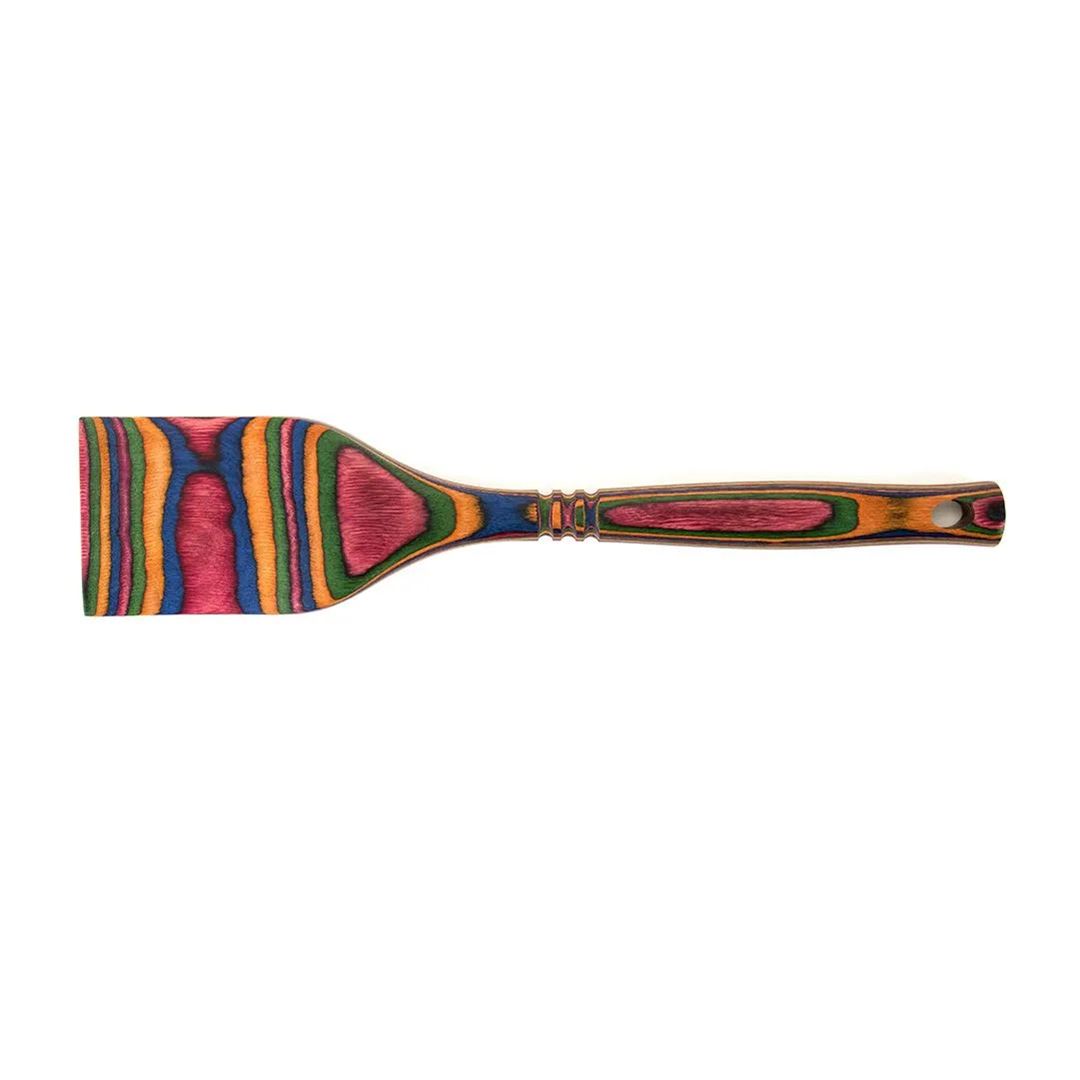 The Rainbow Spatula is a vibrant, colorful pakkawood utensil that’s both eye-catching and durable.