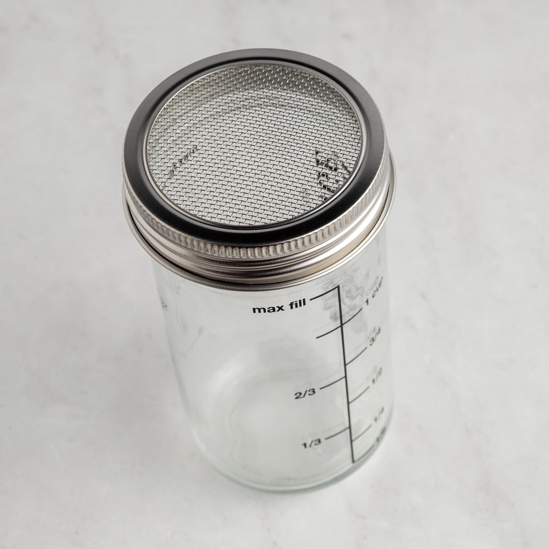 The Spice & Tea Exchange branded Shake Strain & Pour Jar - without pour spout, making strainer visible