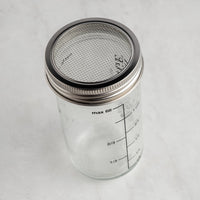 The Spice & Tea Exchange branded Shake Strain & Pour Jar - without pour spout, making strainer visible