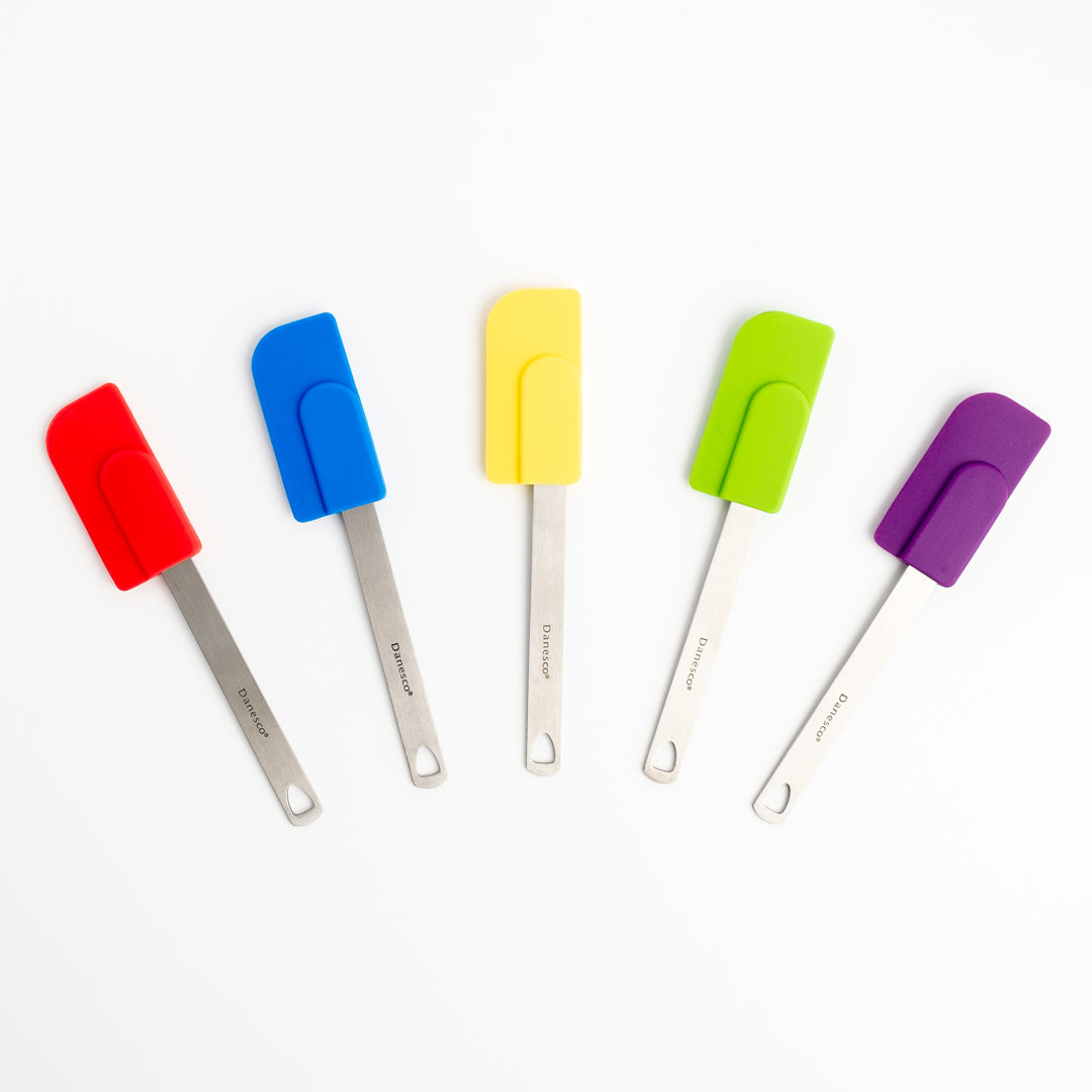 Five Mini Spatulas with stainless steel handles, each in red, blue, yellow, green, and purple, are arranged on a white background—perfect as a colorful and versatile small spatula set for baking.