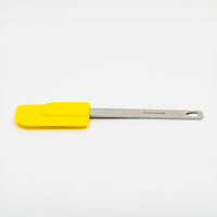 A yellow Mini Spatula with a stainless steel handle and Danesco label is shown on a white background.