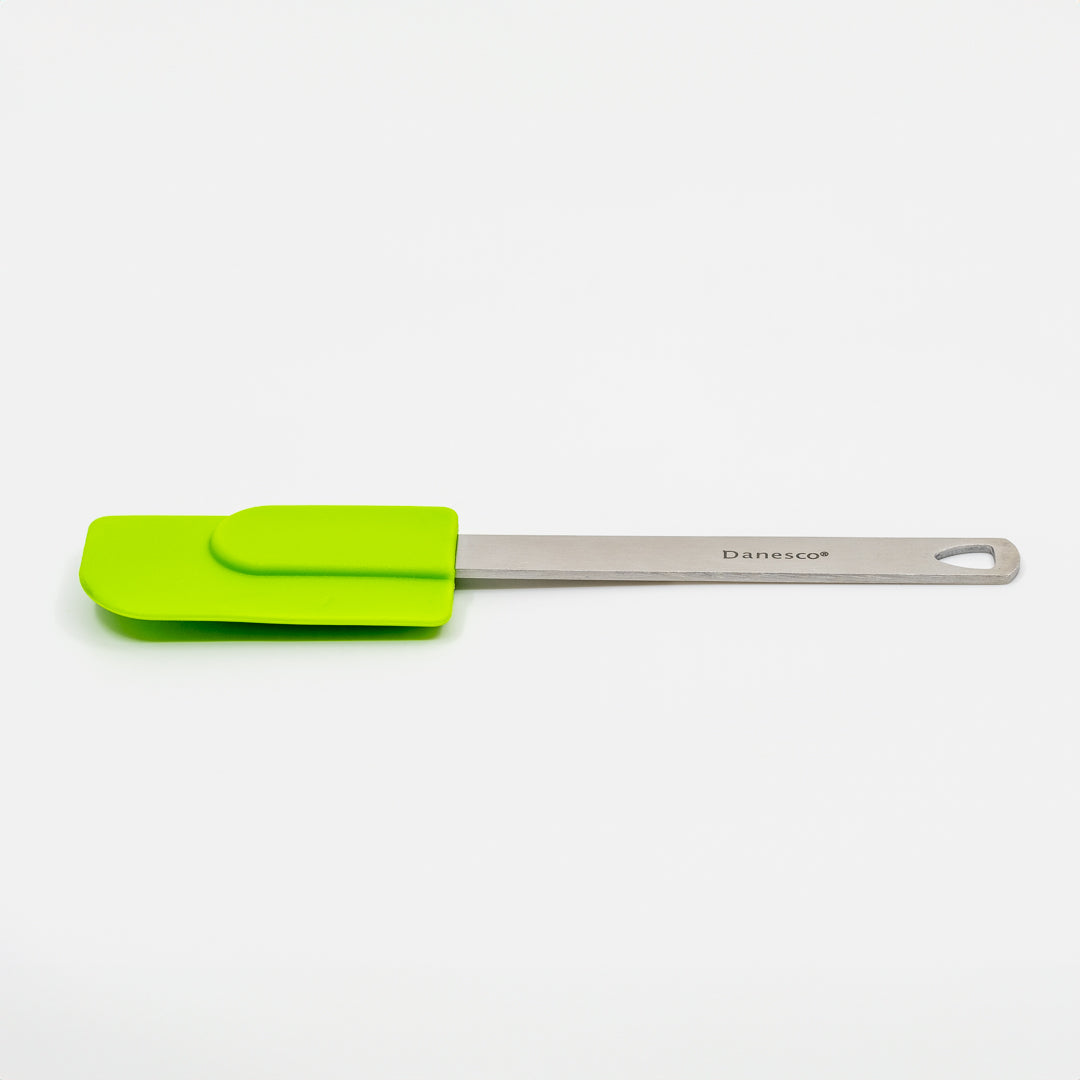 A green Mini Spatulas with a stainless steel handle, branded Danesco, features a hole at the end and is shown on a white background.
