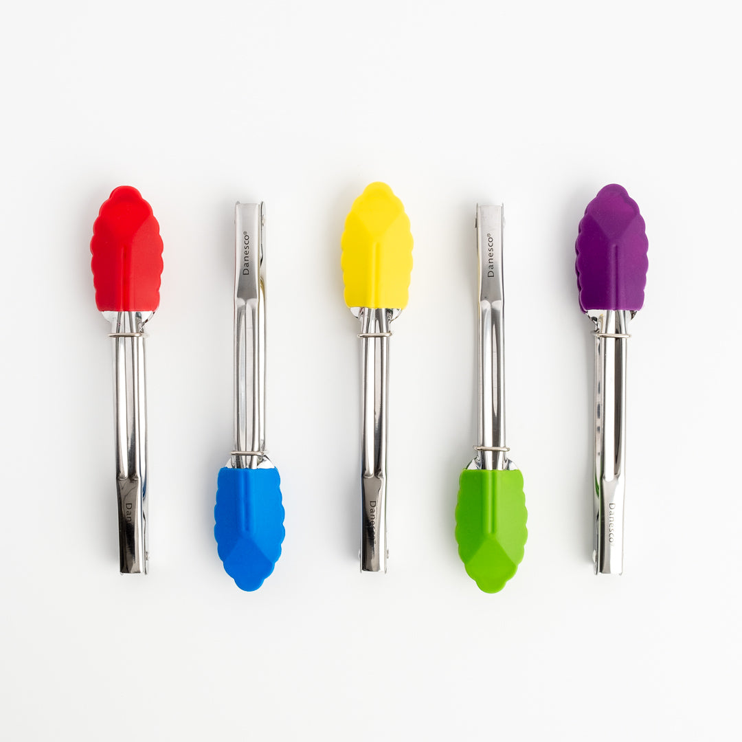 Five Mini Tongs with stainless steel handles in red, blue, yellow, green, and purple are neatly lined up vertically on a white background.