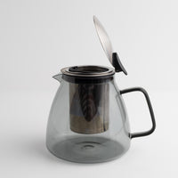 Stormy Glass Teapot with black handle and lid on a white background