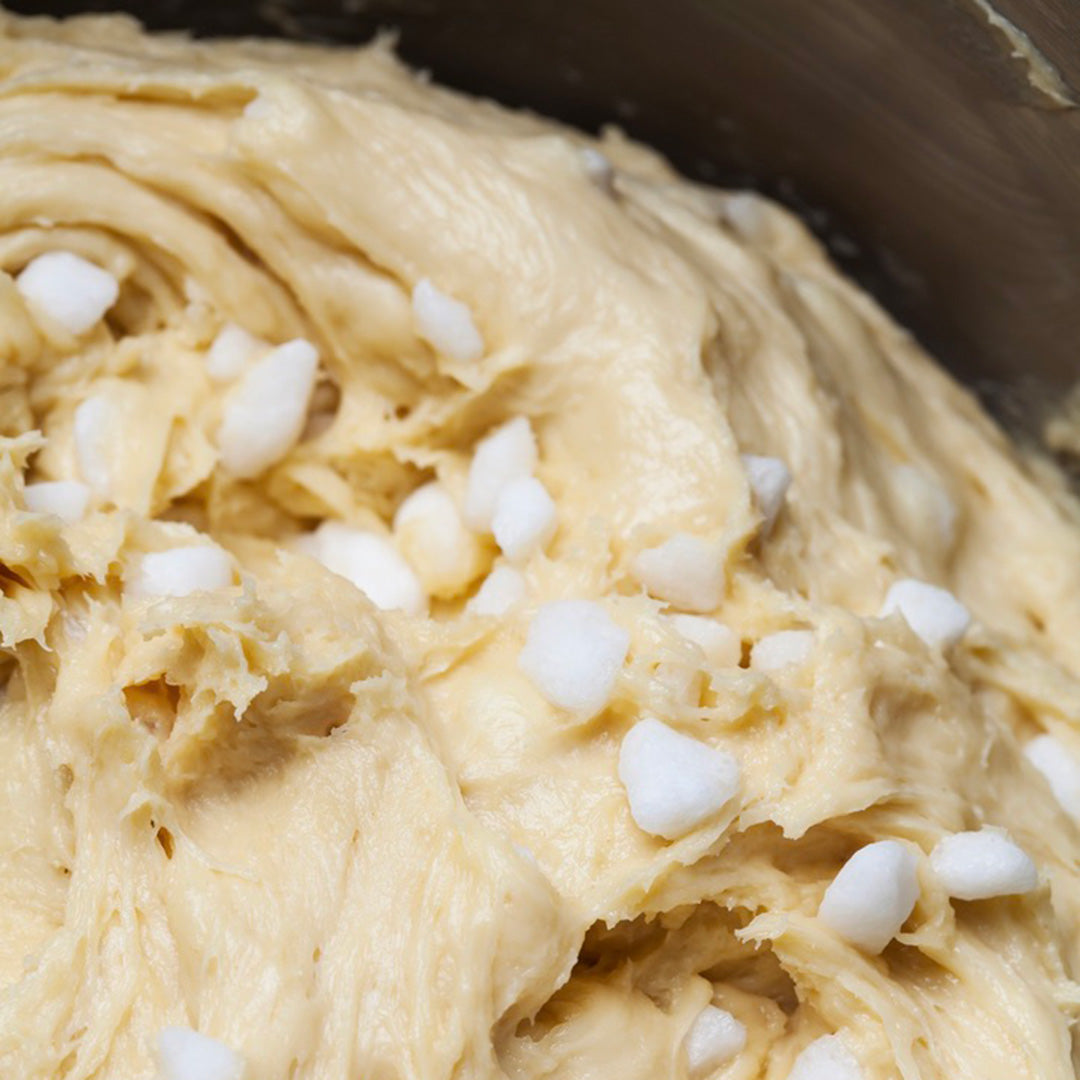 Close-up of cookie dough with white chocolate chips