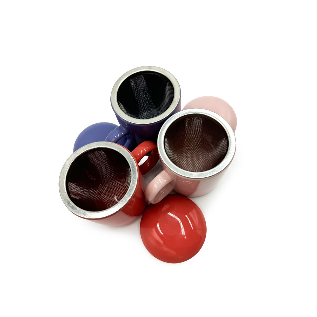 Colorful ceramic tea infusers with mesh lids on a white background