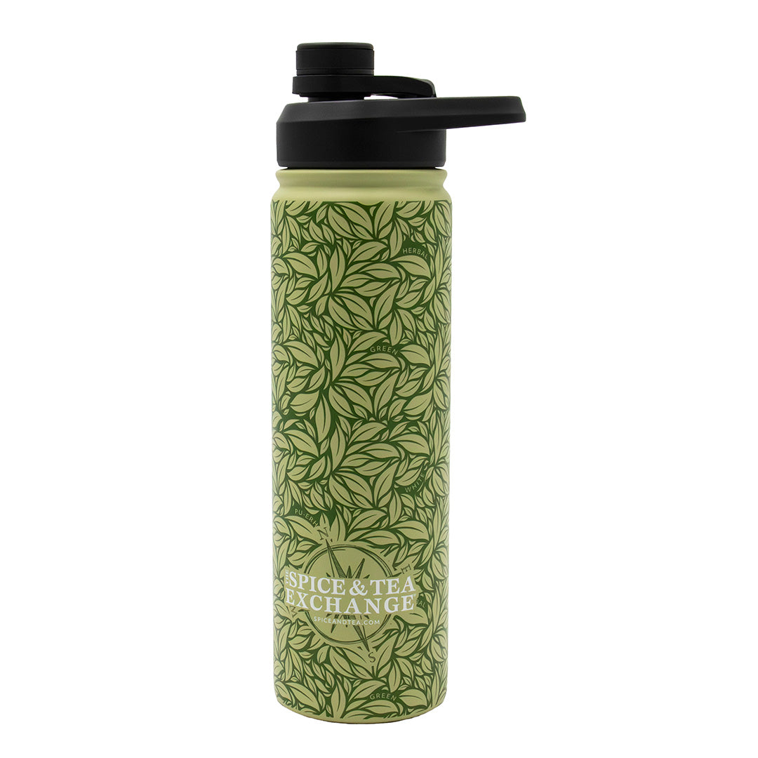 The Tea Leaf Travel Infuser Tumbler is a green reusable tumbler with a leafy design, black flip-top lid, and "Spice & Tea Exchange" on the front—ideal for enjoying your favorite drinks anywhere.