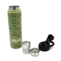 The Tea Leaf Travel Infuser Tumbler—green with a pattern and black lid—features Spice & Tea Exchange branding, plus a removable metal infuser and strainer, all separated and displayed on a white background.