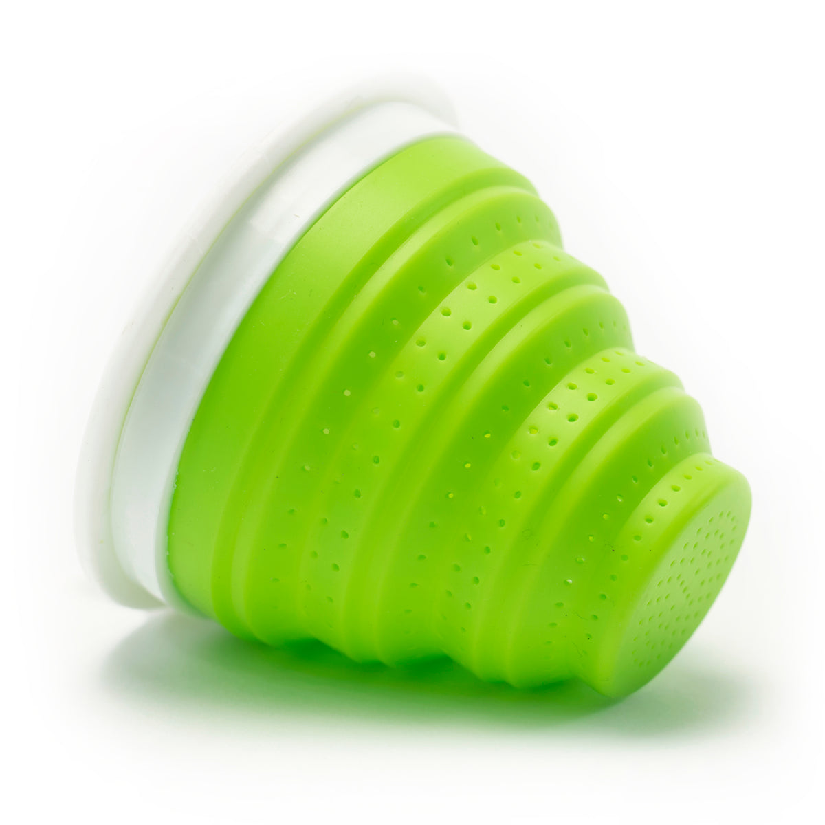 A green collapsible silicone cup with a white rim, displayed closed on its side against a white background—perfect to pair with your favorite Tuffy Steeper Infuser (available in Blue, Green, Purple, Fuchsia) for tea on the go.
