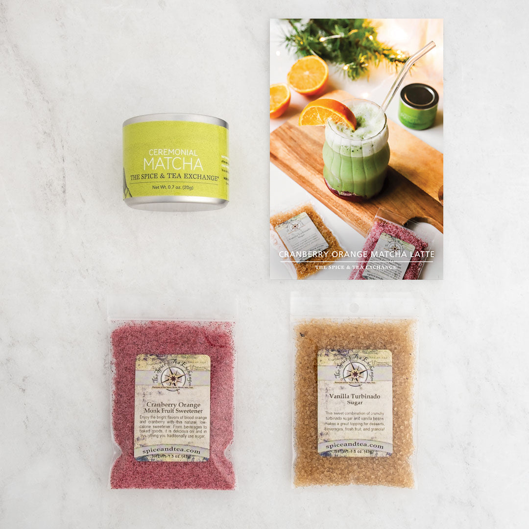 The Cranberry Orange Matcha Latte (Kit) includes a ceremonial matcha tin, recipe card for a Cranberry Orange Matcha Latte, plus cranberry orange and vanilla turbinado sugar packets—perfect for delightful homemade matcha drinks.